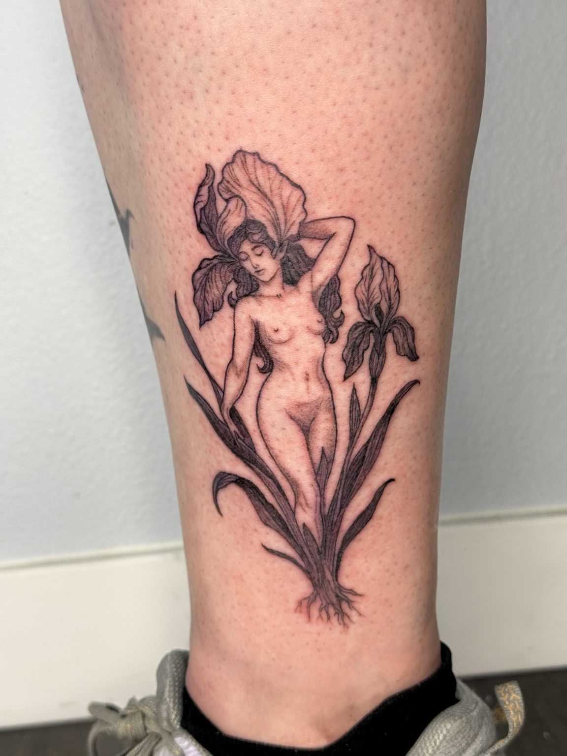 Botanical woman tattoo