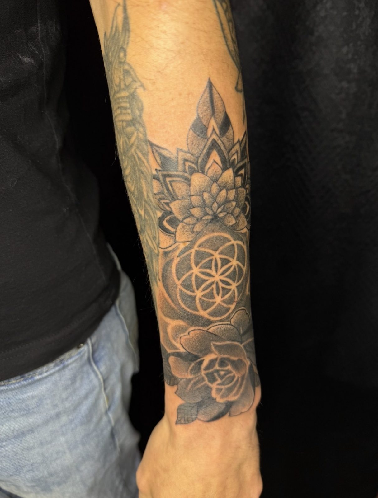 Geometric forearm piece with a mandala, seed of life and rose