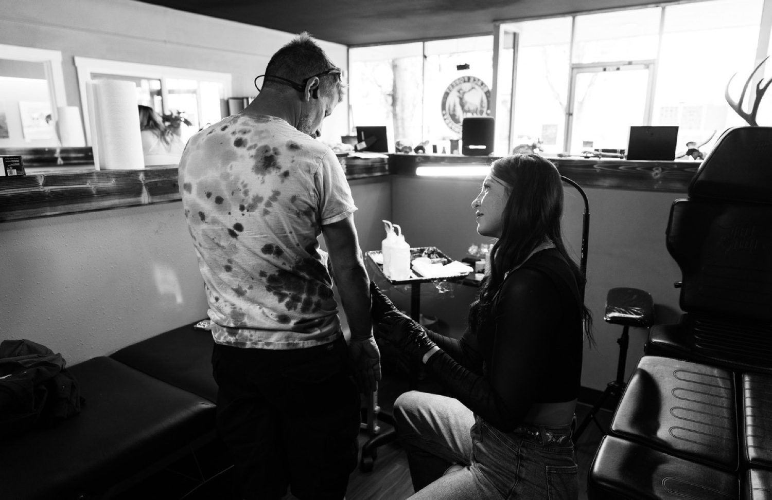 Maddy tattooing a client in her studio